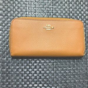 COACH zippered wallet. Tan. Excellent condition.